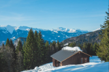 View of snowy chalet Mont Plaisir, ecological alpine accommodation in the Grand Massif mountains